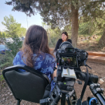 Taliya Finkel interviews Yifat Ben Shoshan, a resident of Netiv HaAsarah. Photo: Kobi Yonatan